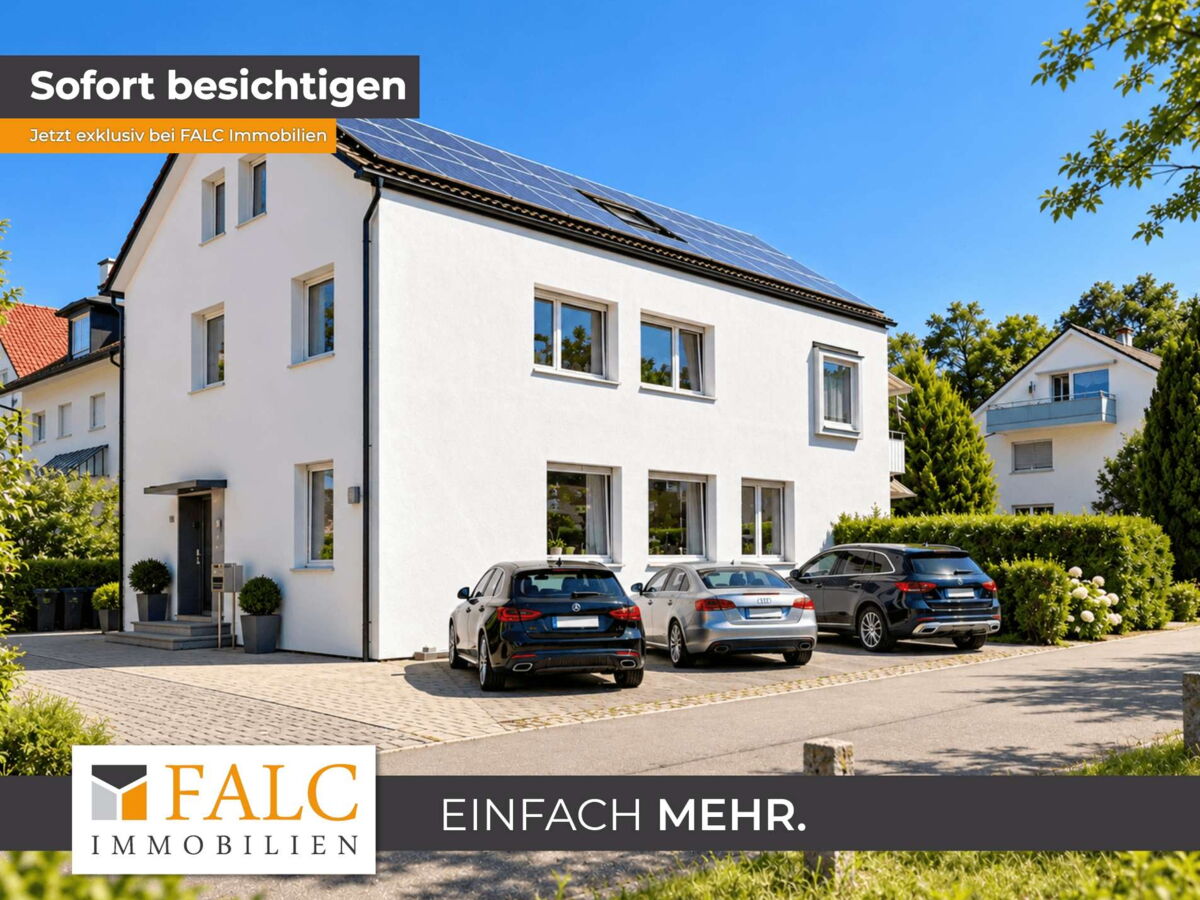 Modernes Mehrfamilienhaus mit Solardach und Fahrzeugen